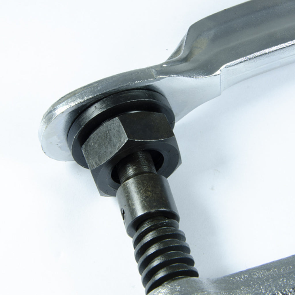 Close-up of threaded screw and pressure head on Jefferson industrial F-clamp