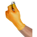 A hand wearing a bright yellow nitrile glove holding a small silver metal ring against a plain white background.